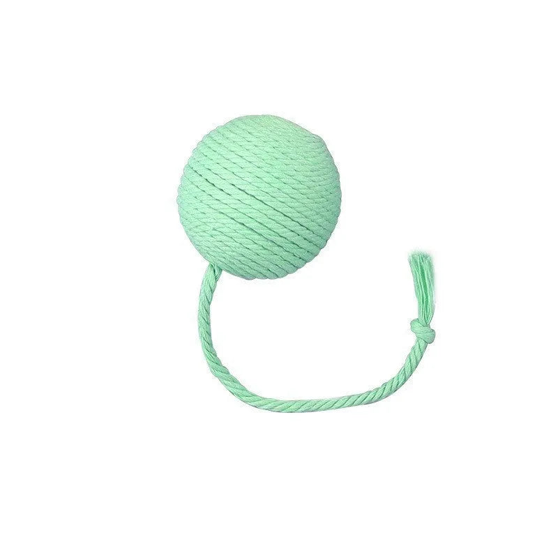 Cat toy ball with attached rope and bell in green, pink, purple or yellow colours showing 6cm and 3cm size comparison