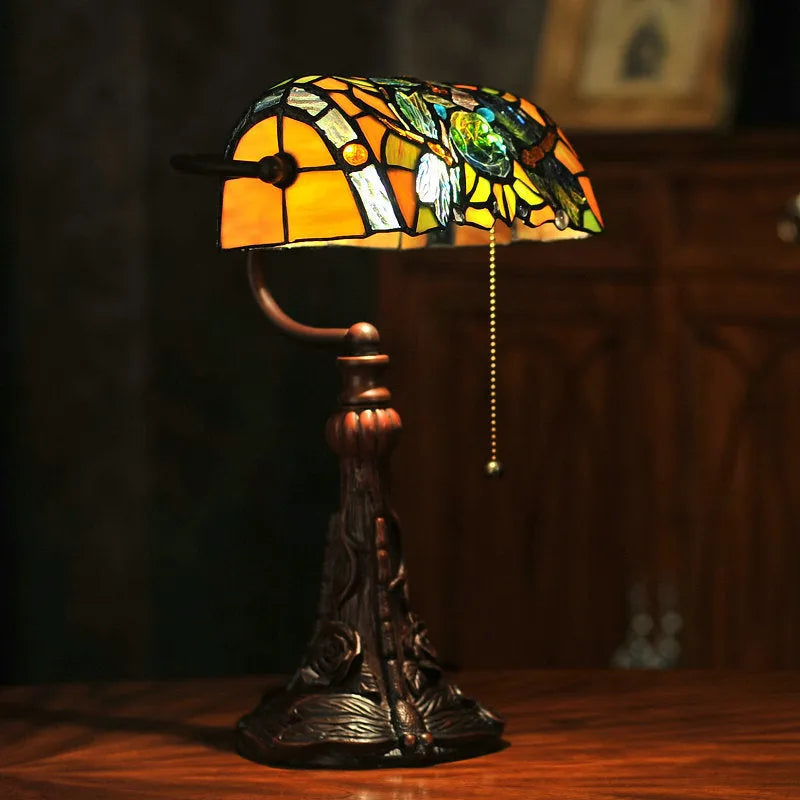 Tiffany table lamp with coloured glass shade on resin base, 36cm tall
