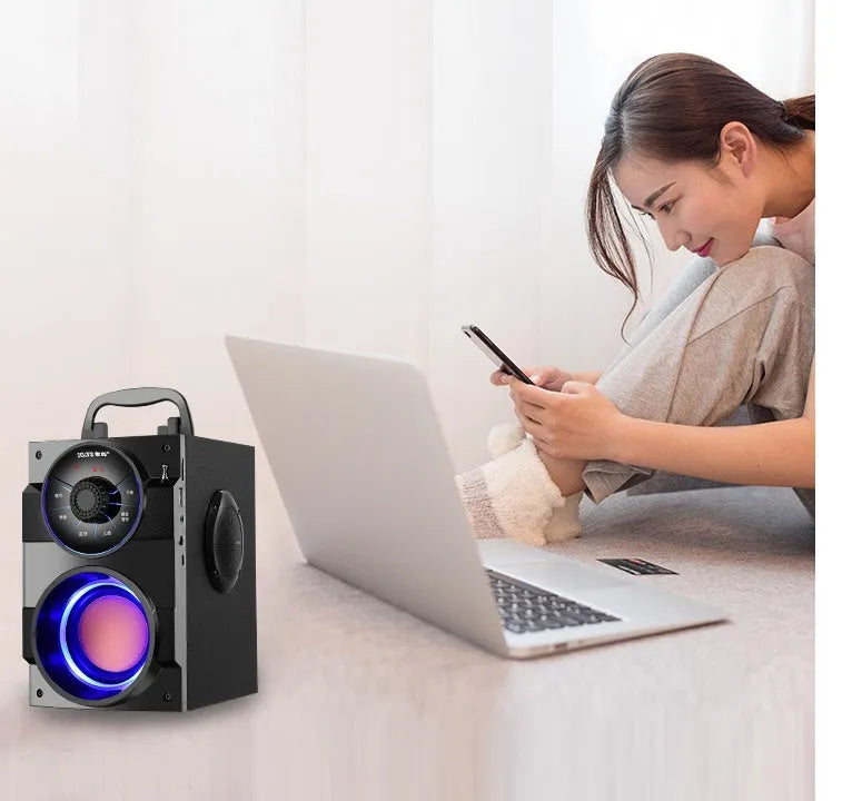 Black portable mini audio system with subwoofer, USB power cable and 3.5mm audio connection