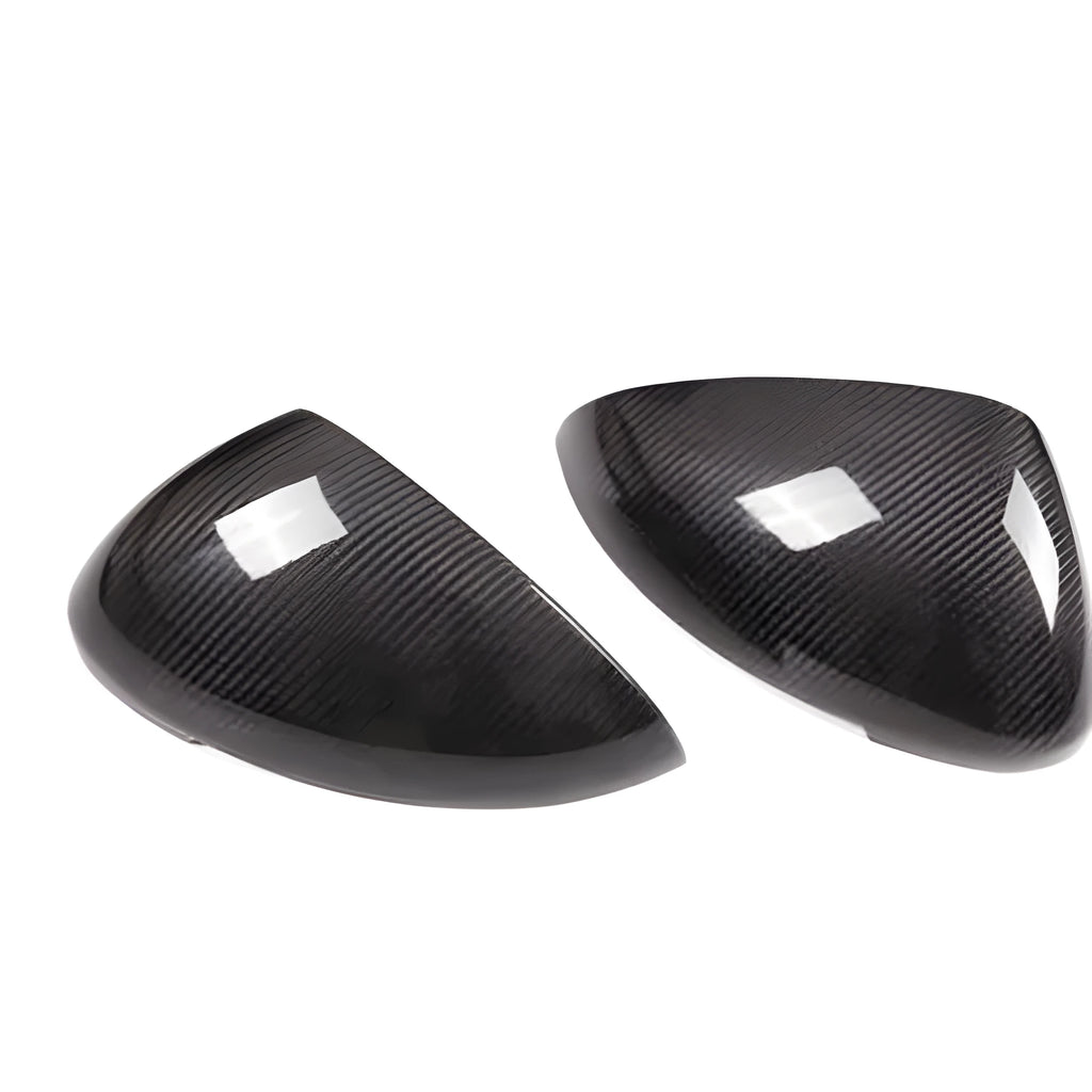 Pair of black true carbon fibre rearview mirror covers for a Porsche Macan.