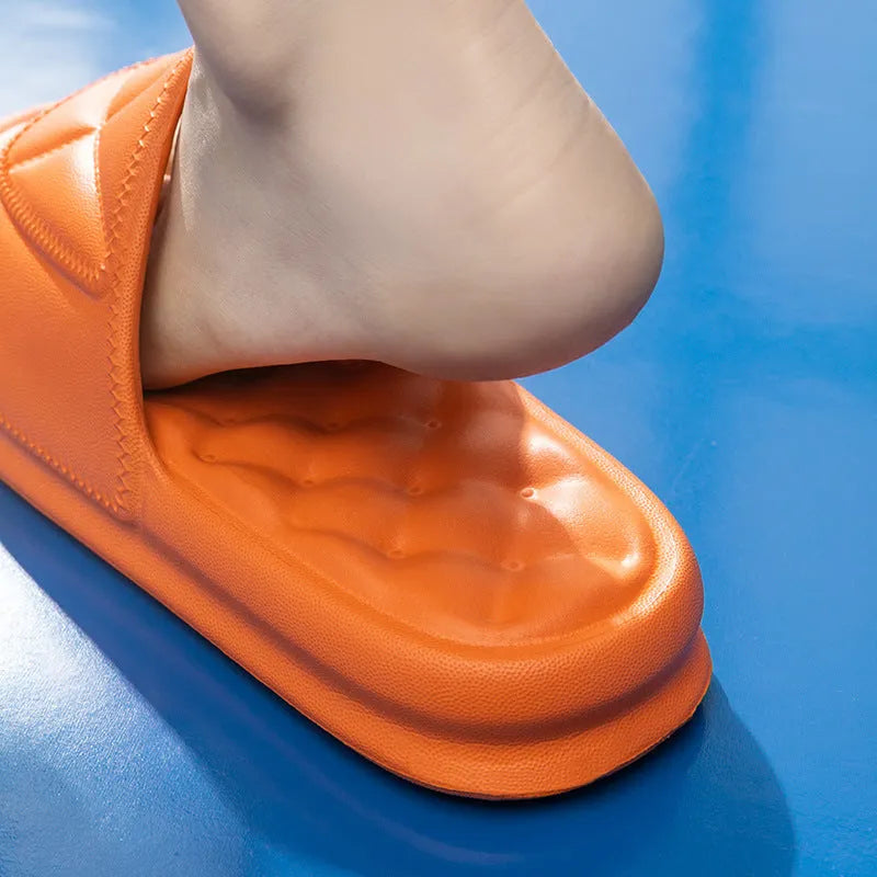 Pair of thick-sole non-slip EVA bathroom slippers shown in a choice of colours on a bathroom floor.