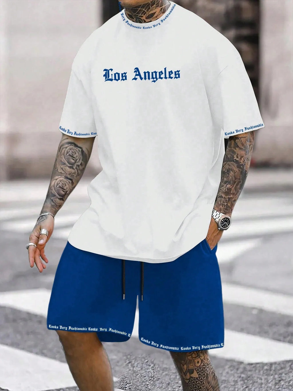 Sports style short-sleeved top and matching shorts set laid flat, showing thin polyester blend fabric.