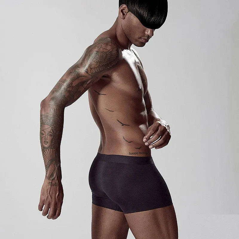 Men's seamless one-piece modal underwear in green on a mid-waist mannequin.