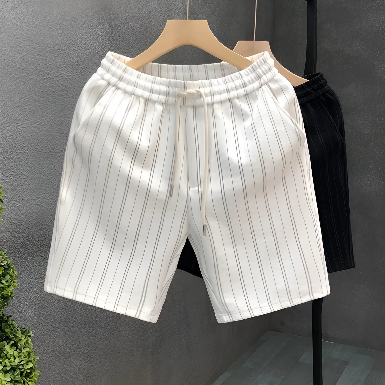 Men's black and white striped casual fleece-lined shorts with a double-layer waistband and straight leg.