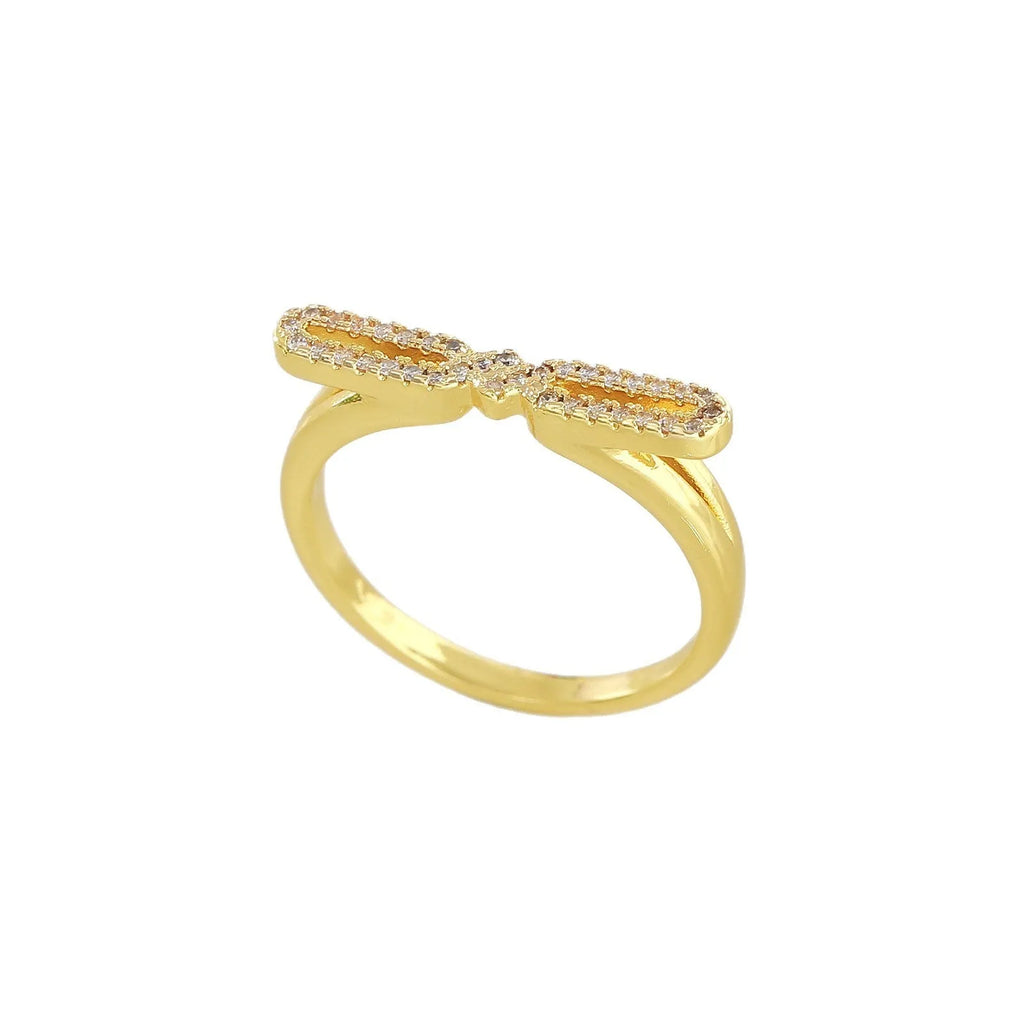 Fashion bowknot ring for women, copper with electroplated gold finish, bow shape on white background