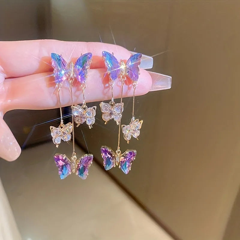 Silver needle crystal flowers butterfly tassel earrings in blue purple colour with electroplated alloy construction
