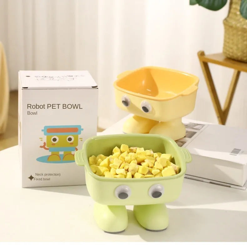 Green robot-shaped tilted cat bowl with detachable inner dish on a non-slip base.