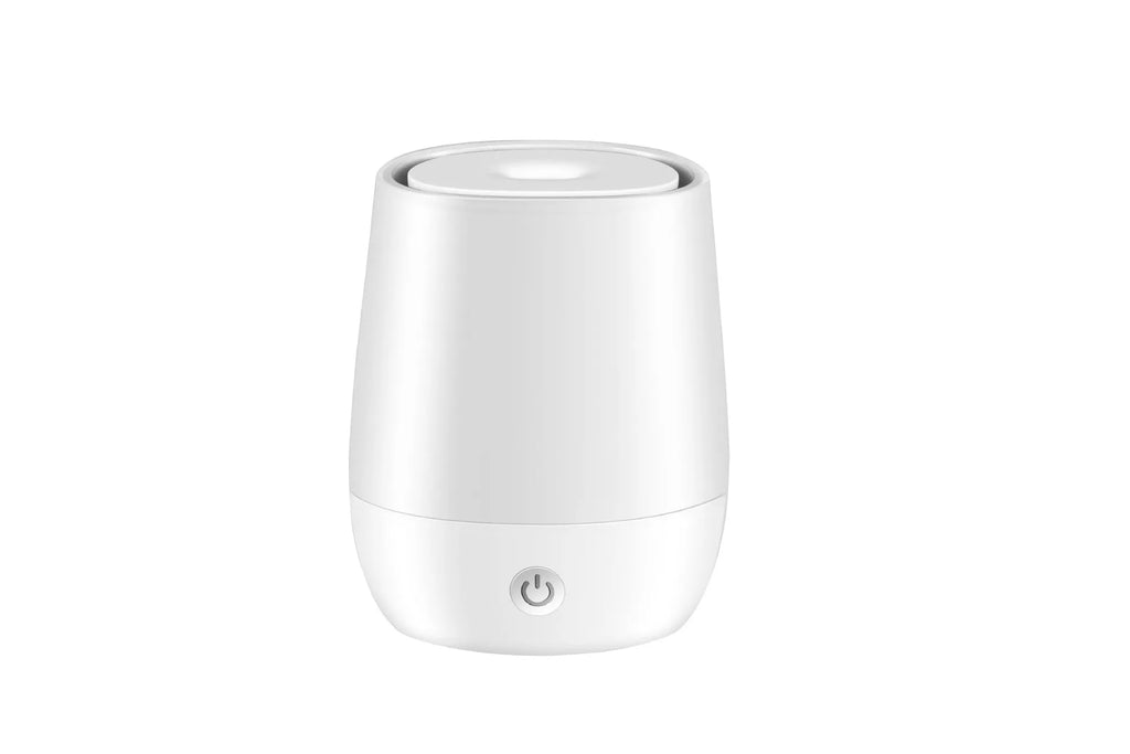 White USB aroma diffuser with simulated flame effect on a wooden surface.
