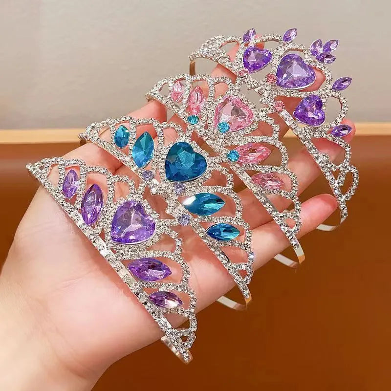 Children's electroplated alloy crown headband with pink crystals, shown on a model for scale.