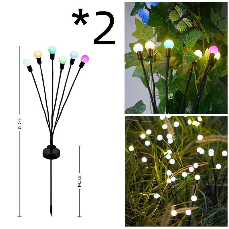 Solar-powered LED garden ground light with multiple heads and a stainless steel stake inserted into soil.