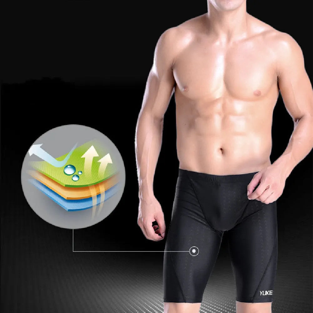 Men's black polyester swimming set with trunks, anti-fog goggles, waterproof cap, ear plugs, nose clip, and carry bag