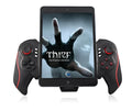 PG-9023 wireless telescopic game controller extended with a phone inside, showing buttons and USB port.