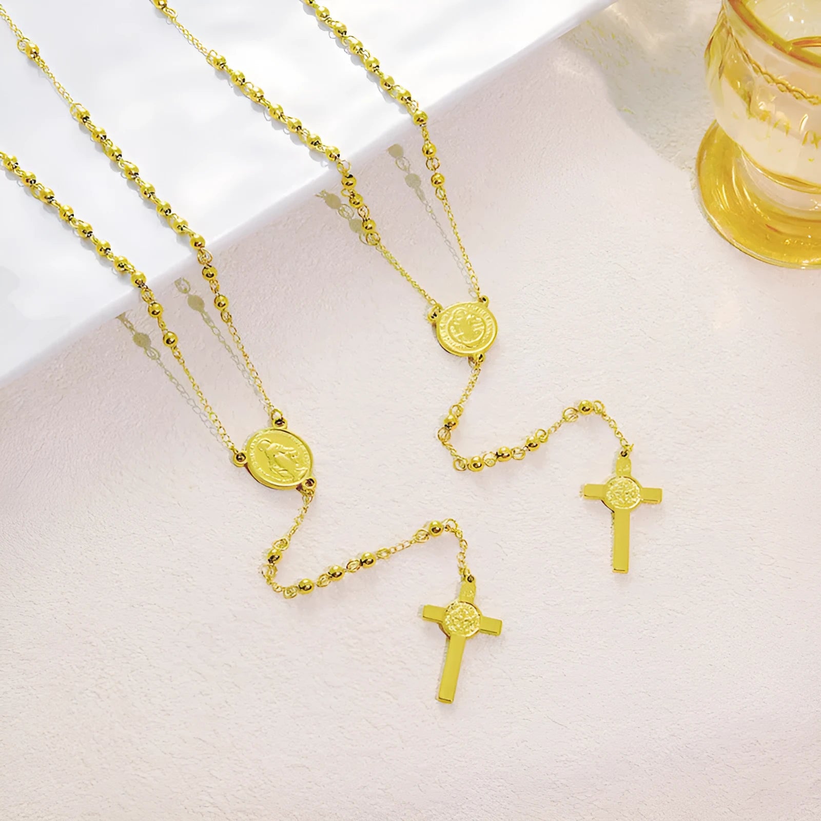 Stainless steel cross pendant necklace in golden colour with a priest pendant design on a simple chain
