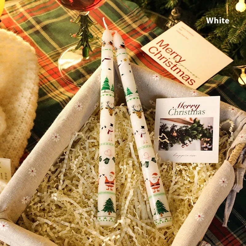 Christmas printed paraffin cylinder candle in bright red, 2.2x25cm, on a table