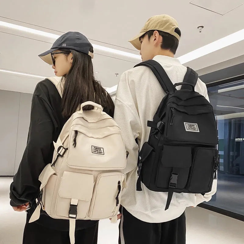 Black nylon student backpack with laptop compartment and front pocket