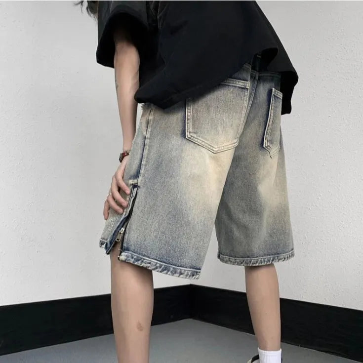 Blue retro denim shorts with a wide-leg loose fit and tattered distressing on the legs.