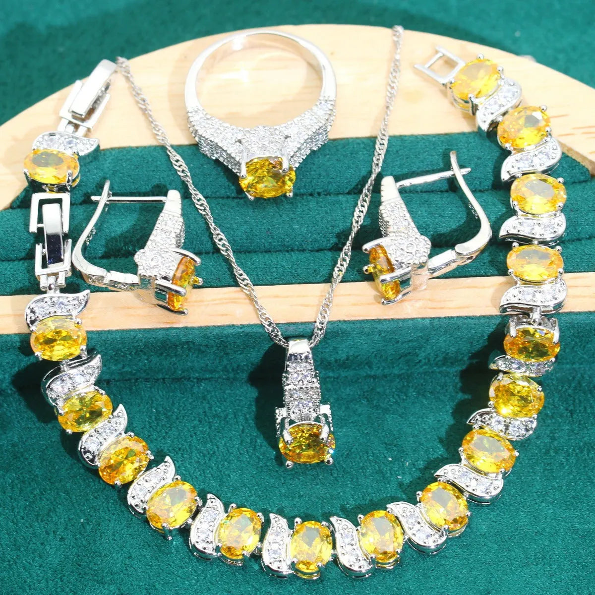Four-piece bridal jewellery set with water wave chain necklace, bracelet, earrings, and ring in alloy with zircon detailing