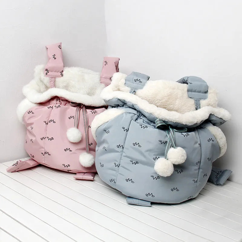 Winter pet carrier backpack in blue and pink made of soft flannel for cats and dogs