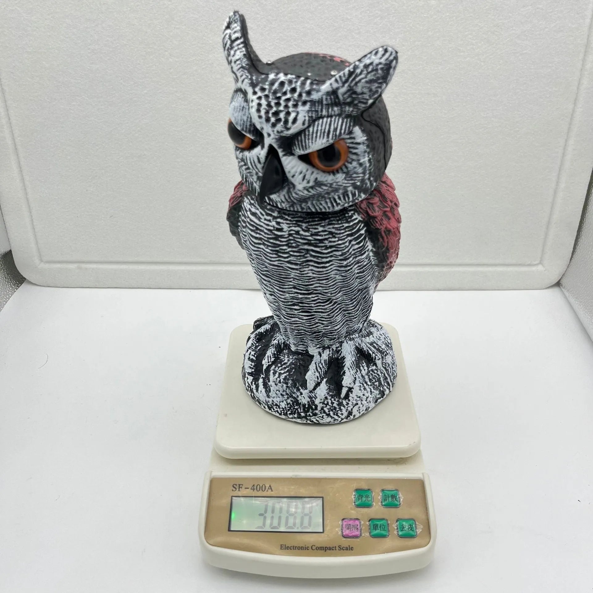 PE plastic artificial owl bird scarer ornament with shaking head, shown in bag-style mounting option.