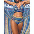 Blue women's three-piece bikini swimsuit with cross bandage design and high waist briefs.