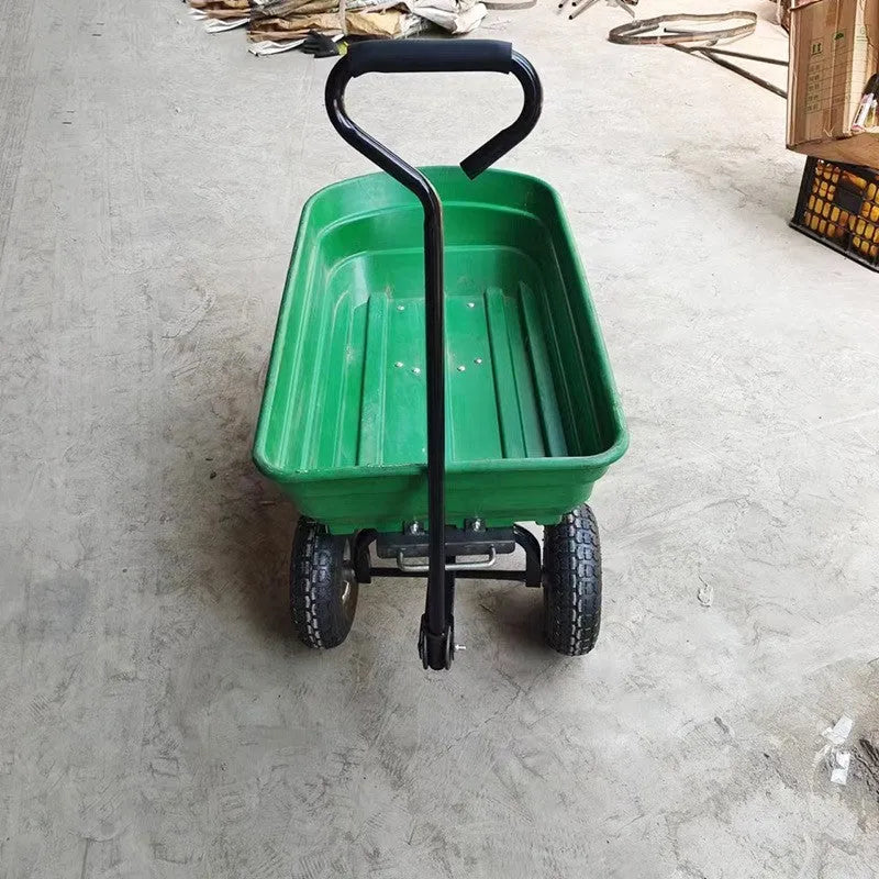 Green four-wheel plastic dumptruck with a large haulage body on a steel-reinforced frame.
