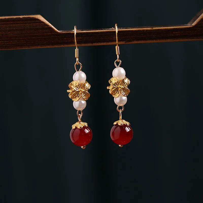 A pair of geometric-shaped vintage court style alloy earrings with an electroplated finish for women.