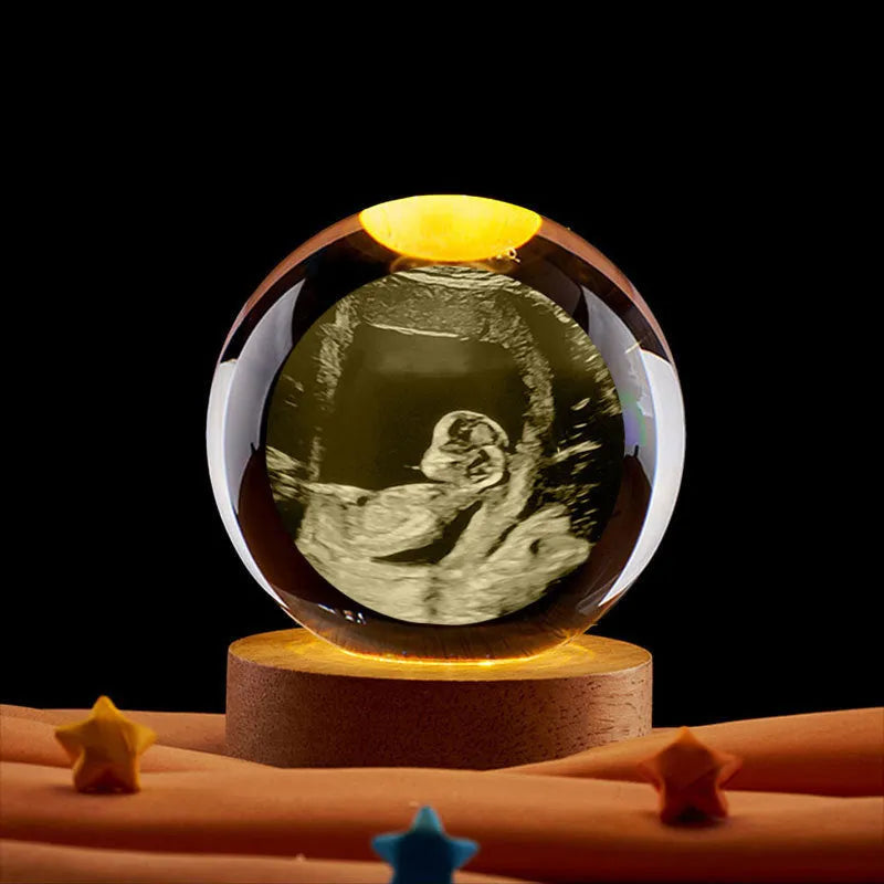 Clear crystal ball night lamp with warm light placed on base, 6cm or 8cm size option available