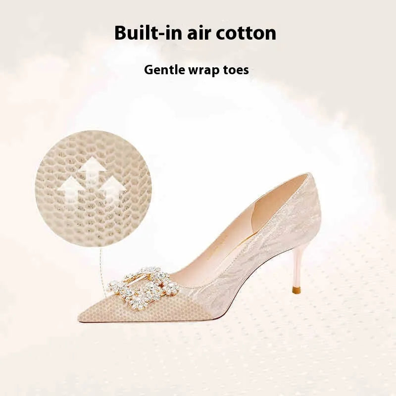 Champagne gold pointed-toe stiletto high heels with rhinestone decoration.
