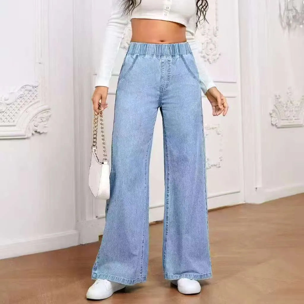 Light blue washed wide-leg straight-leg women's jeans on a hanger, showing mid-waist and zip fly detail.