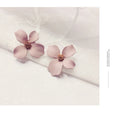 Alloy flower stud earrings for women in white or pink electroplated colour options