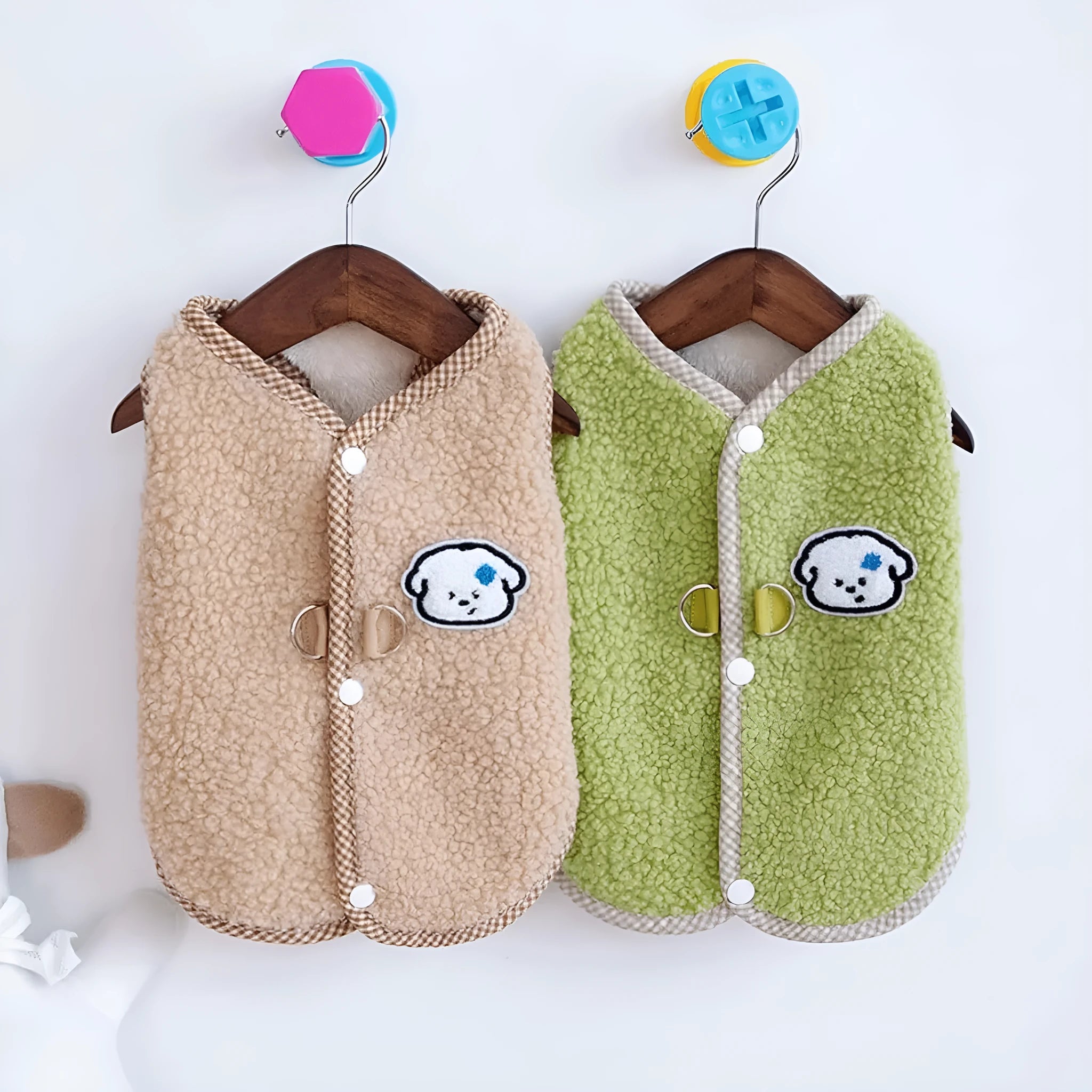 Green coral fleece dog vest with a metal leash ring on the back for a small dog.