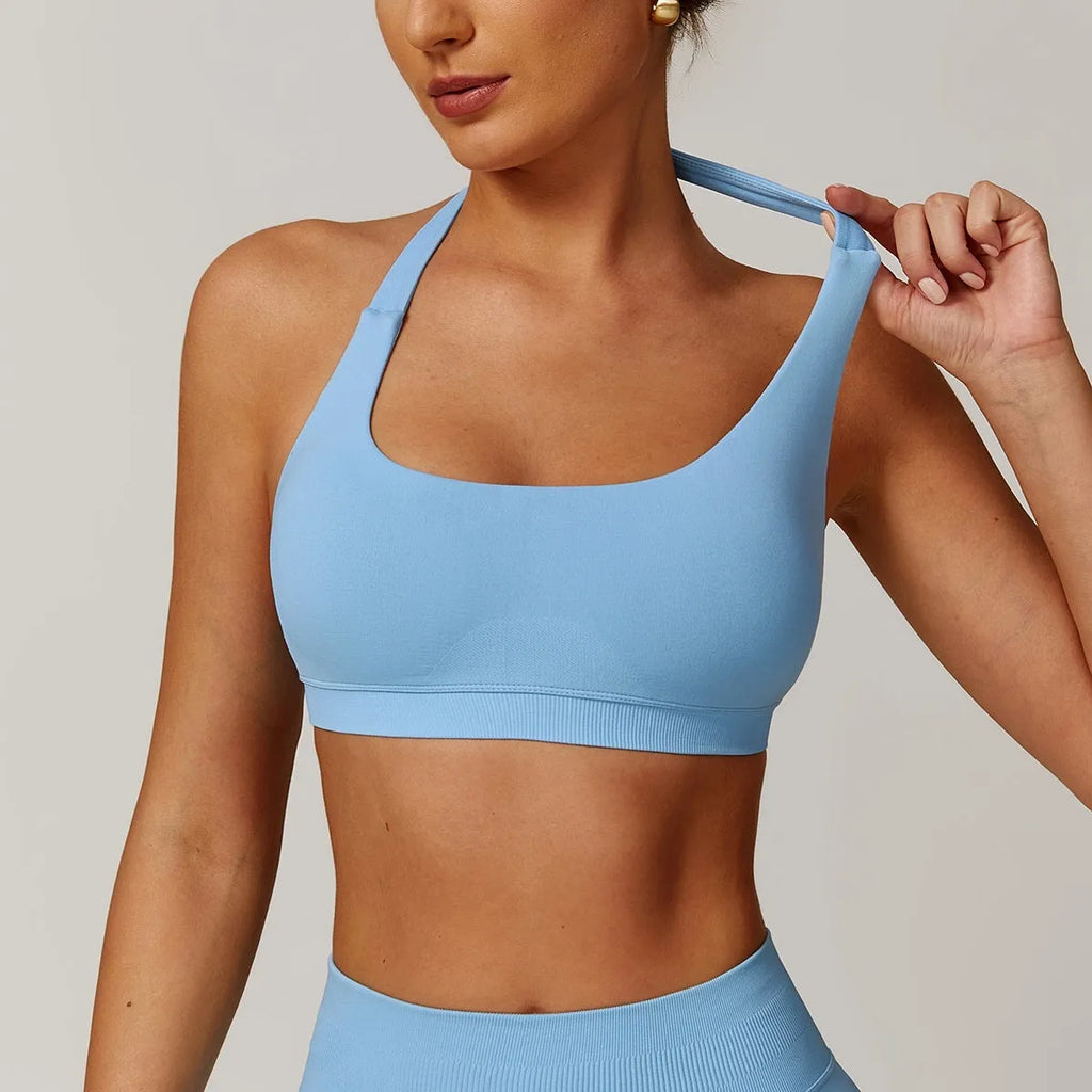 Women's halter yoga bra with removable pads in five colour options showing front and back views