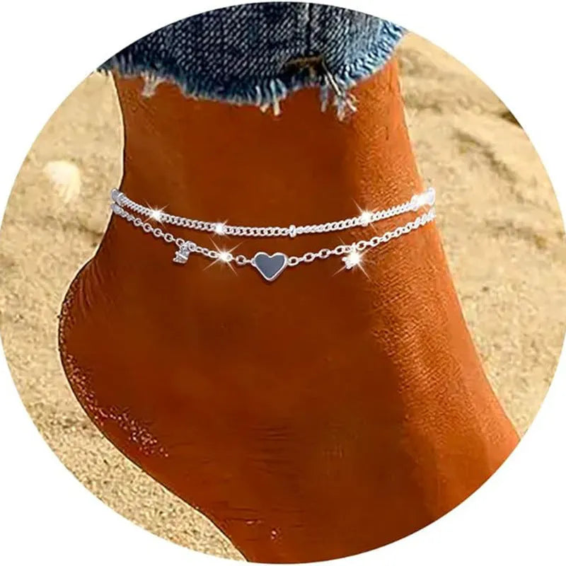 Heart-shaped zircon copper anklet in silver on display