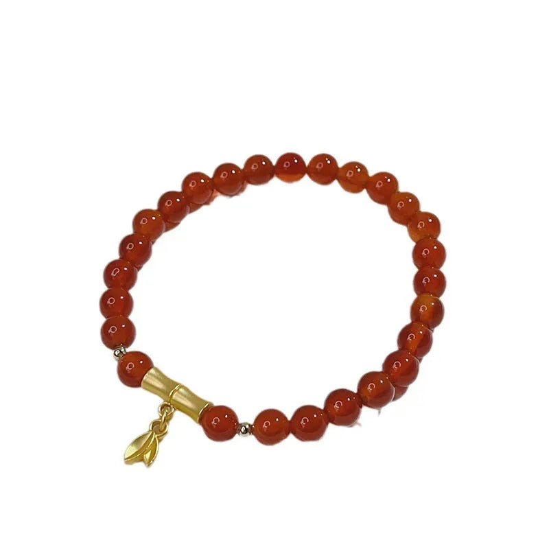 Handcrafted red agate bracelet with Chinese Dragon and Lucky Bag festival motifs