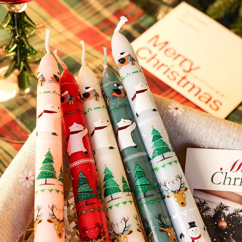 Christmas printed paraffin cylinder candle in bright red, 2.2x25cm, on a table