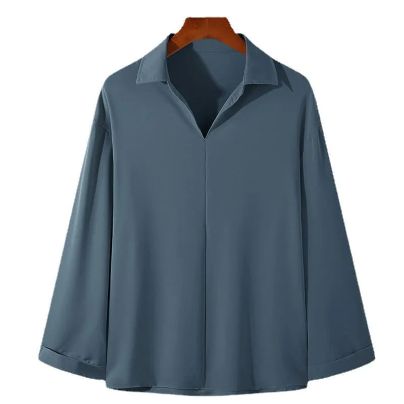 Men's loose lapel long sleeve shirt in a solid colour on a hanger.