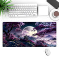 Large 400x900mm black gaming desk mat with geometric pattern, showing keyboard and mouse placed on it.