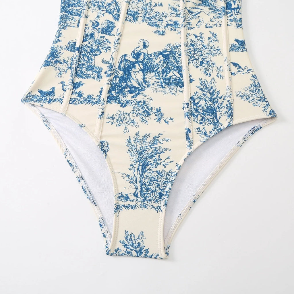 Women's blue one-piece swimsuit set with matching gauze skirt and separate swimsuit piece on size chart