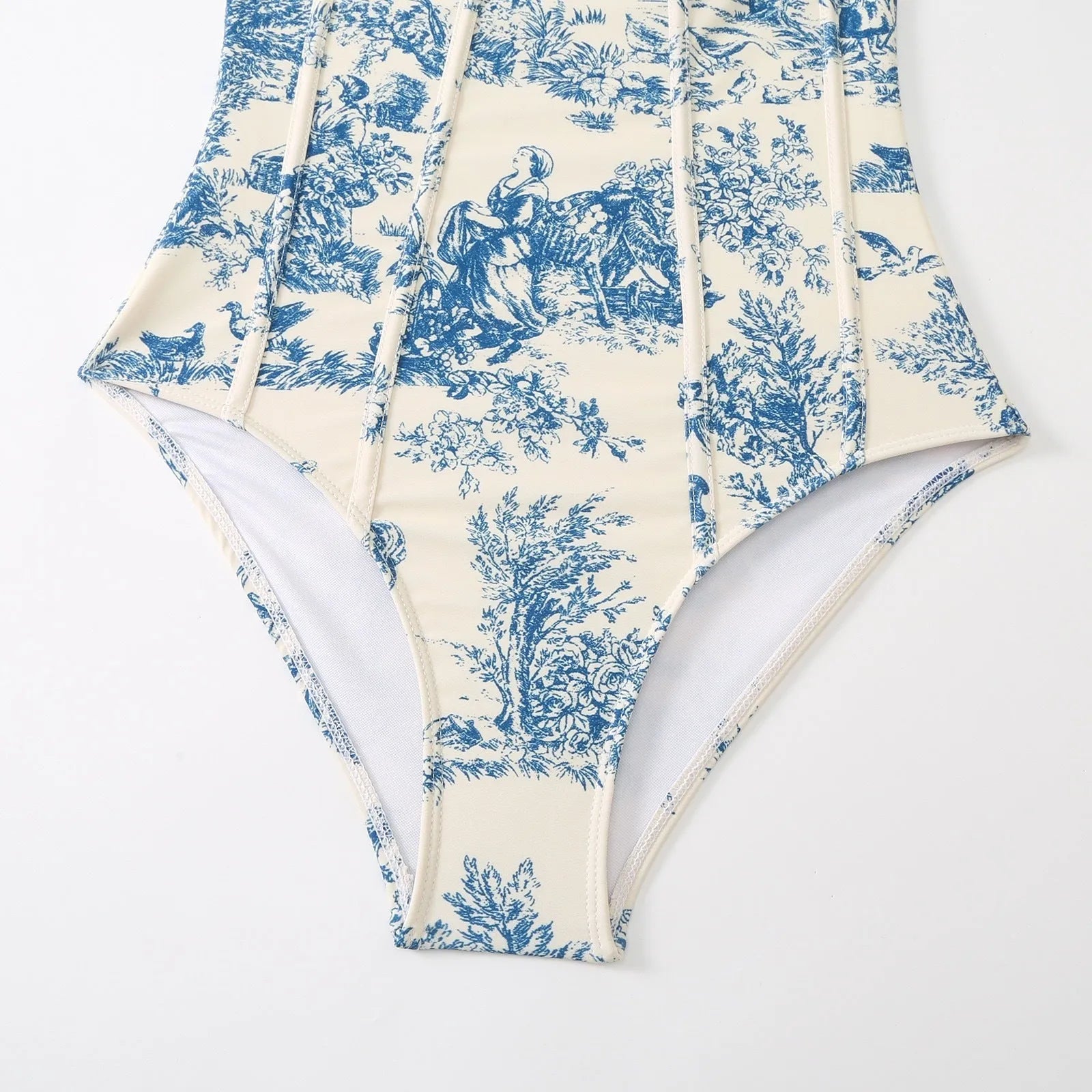 Women's blue one-piece swimsuit set with matching gauze skirt and separate swimsuit piece on size chart