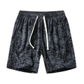 Men's camouflage patterned corduroy shorts with elastic high waistband in straight leg cut.