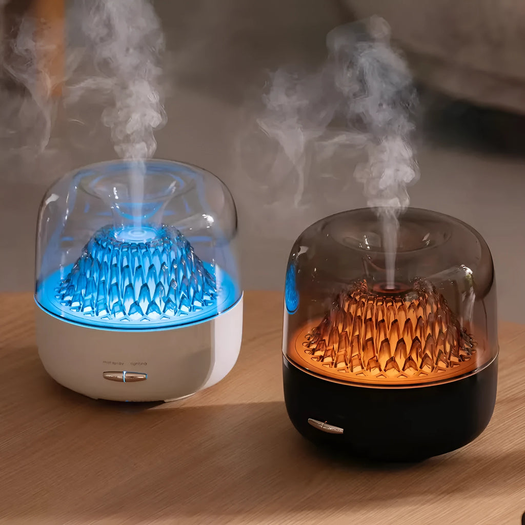Round resin aroma diffuser with colourful light in beige, on a desktop, with a single fog nozzle