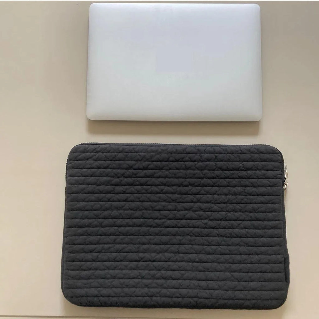 Black and white cotton cloth anti-seismic laptop sleeve or clutch bag for tablets, shown in three size options.