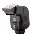 Compact SLR camera flash unit with its head tilted upwards, showing hot shoe mount.