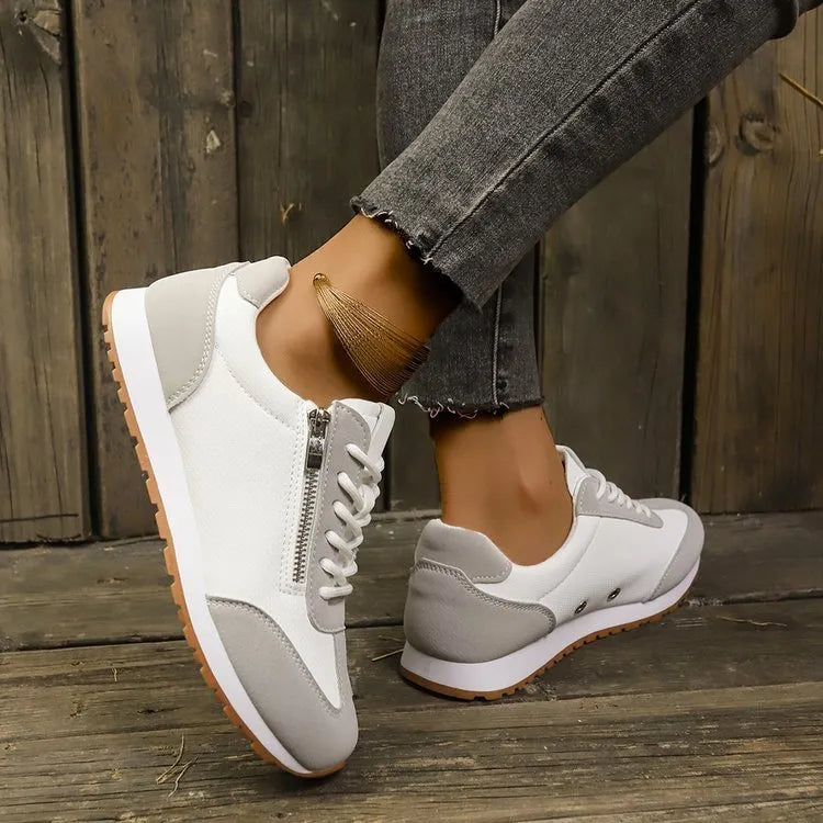 Women's flat-heeled shoes in champagne colour with a PU upper and rubber sole.