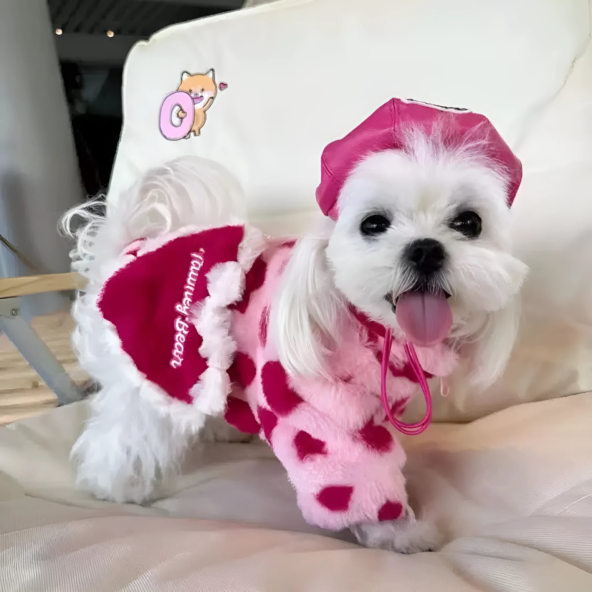 Small dog wearing pink polyester plush warm coat in British style design