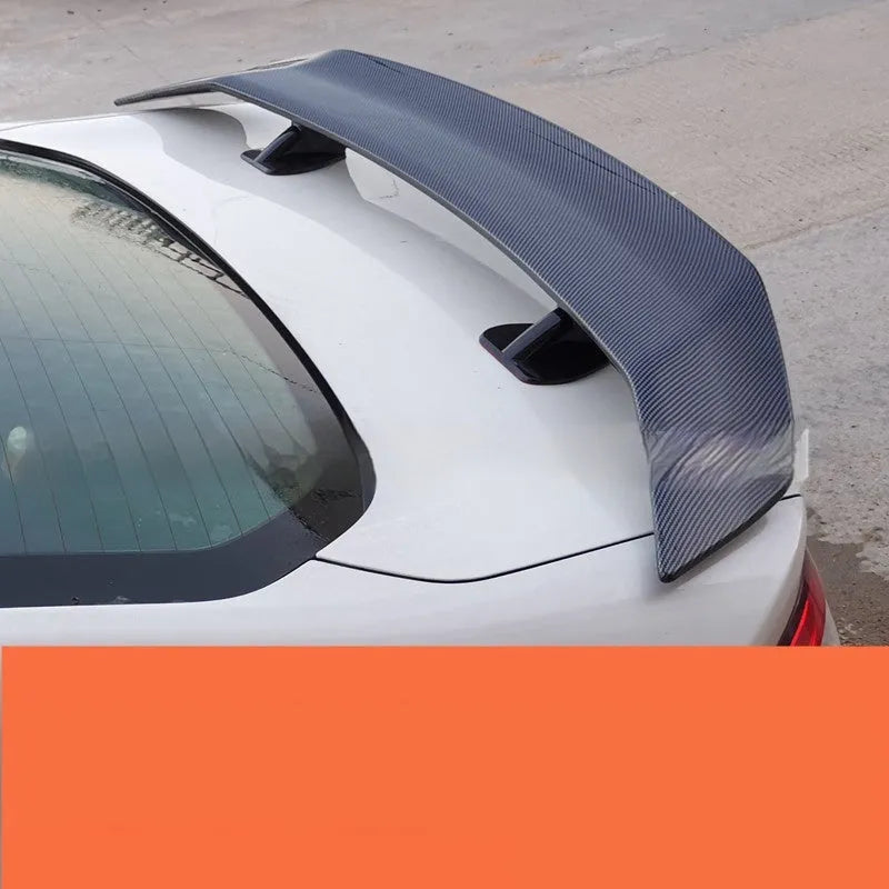 Universal punch-free ABS plastic car spoiler tail wing in bright black finish.