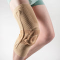 Black and blue adult sports knee pad for basketball and running, made of nylon and spandex.