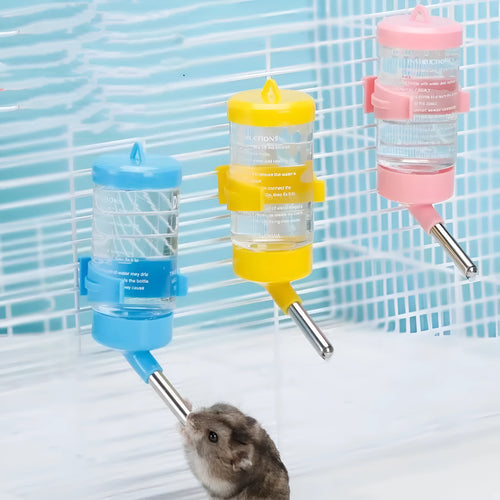 Green plastic ball kettle water feeder for small pets attached to a wire cage.
