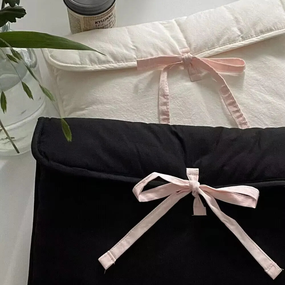 Women's black and white striped ballet bow quilted computer bag showing nylon material