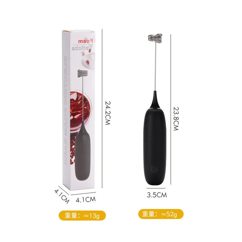 Black and white handheld electric milk frother with blending function on kitchen counter
